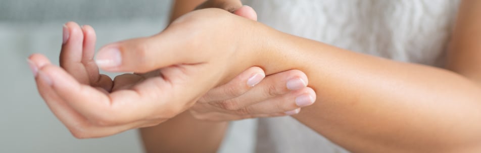 image of a person massaging their wrist