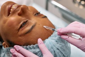 image of woman getting botox injections in the forehead