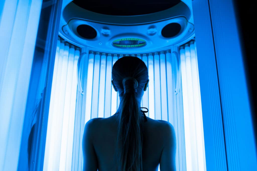 Woman using a tanning bed